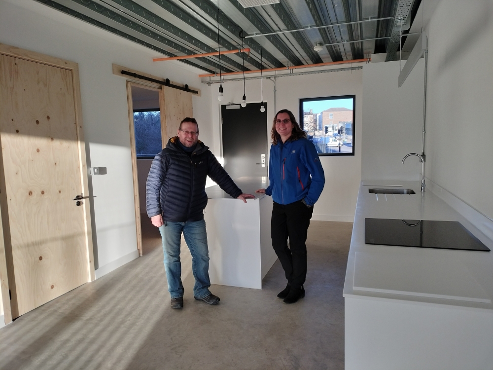 Leeds Community Homes Development Director Jimm Reid, with Wrigleys’ Morgan Gibson inside one of the new affordable homes at Aire Lofts